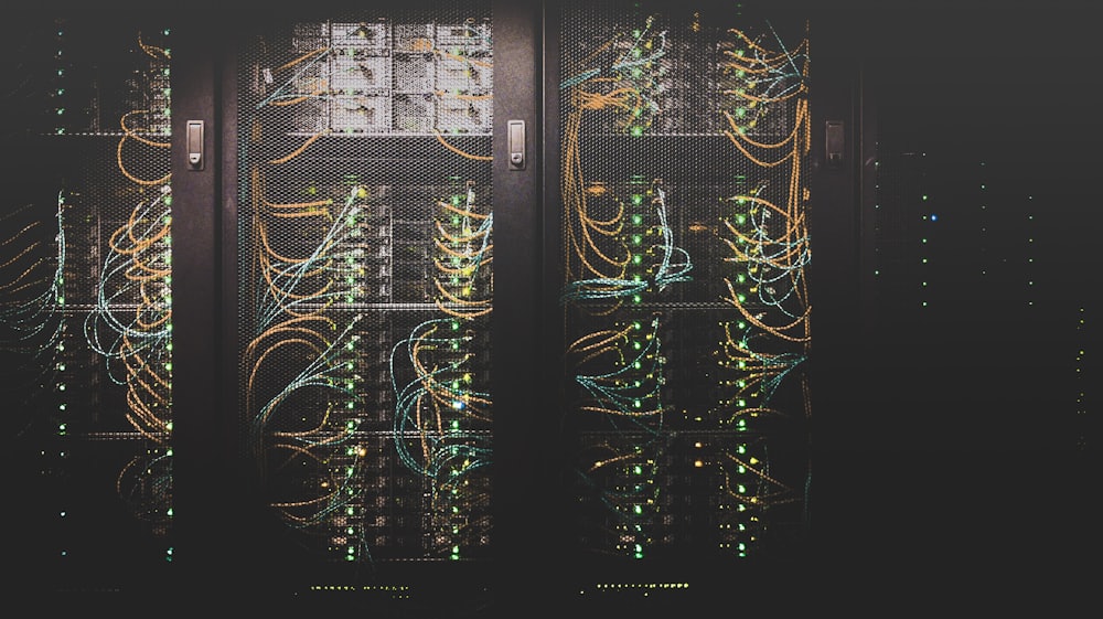 Rows of hosting servers with status lights inside a data centre